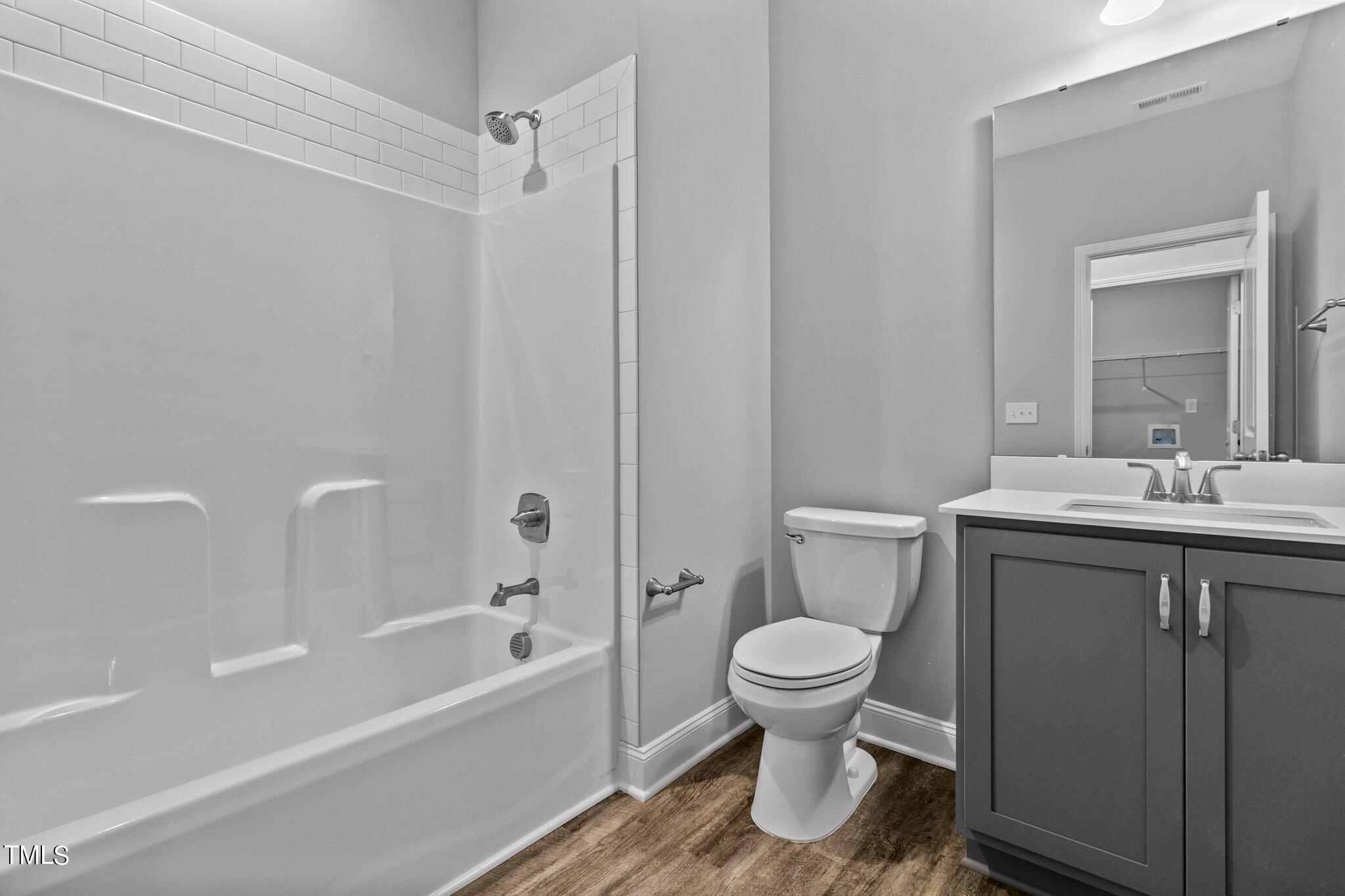 111 Regis Lane Coats, NC 27521 - Photo 14 of 36 a bathroom with a sink toilet and shower