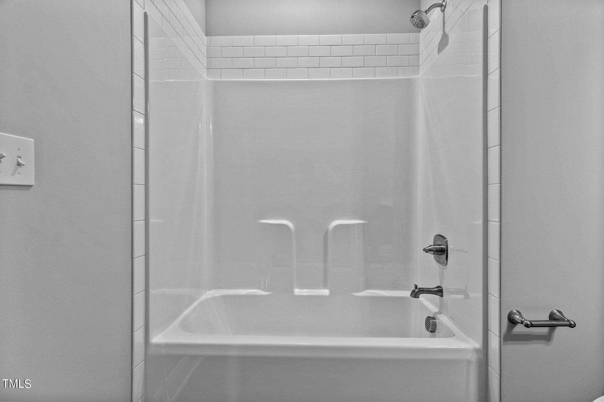 111 Regis Lane Coats, NC 27521 - Photo 15 of 36 a white bath tub sitting next to a white sink