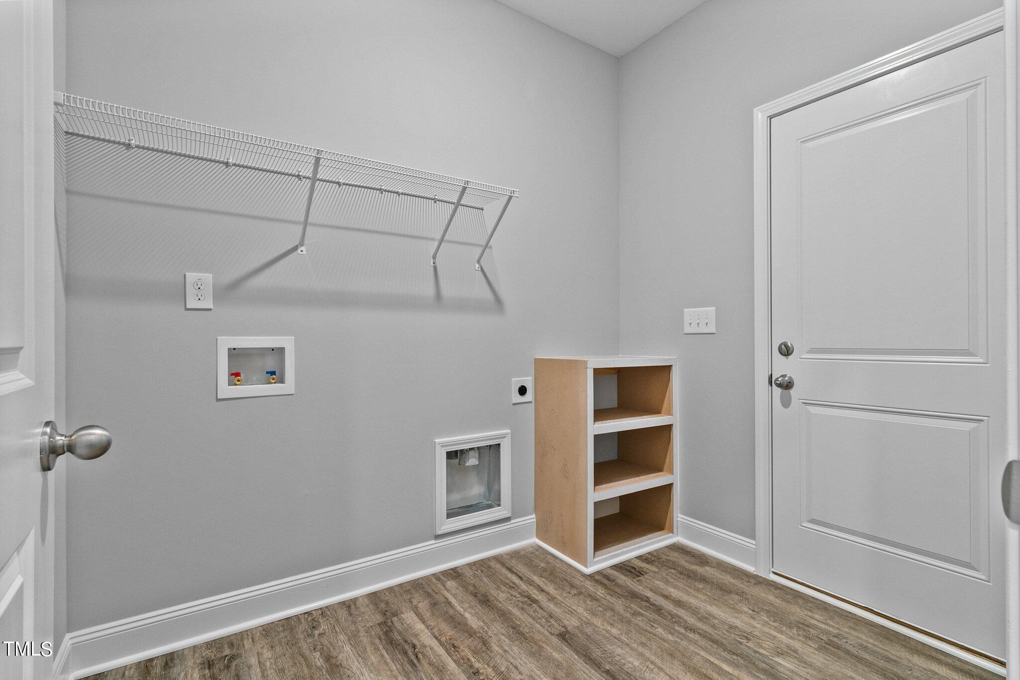 111 Regis Lane Coats, NC 27521 - Photo 16 of 36 a view of an empty room with wooden floor and closet