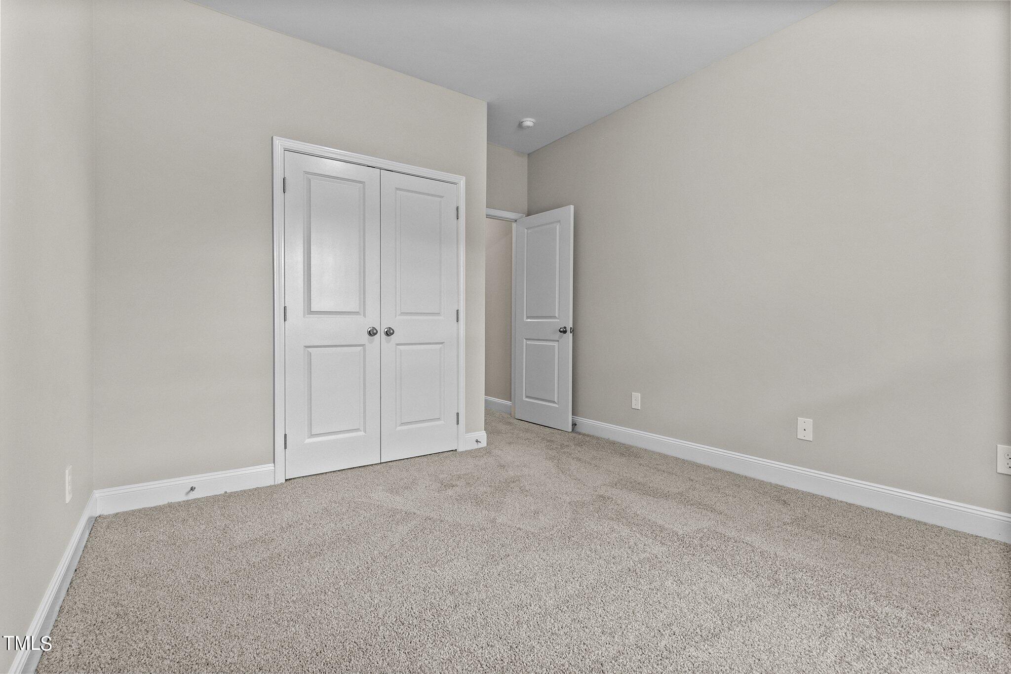 111 Regis Lane Coats, NC 27521 - Photo 18 of 36 a view of an empty room