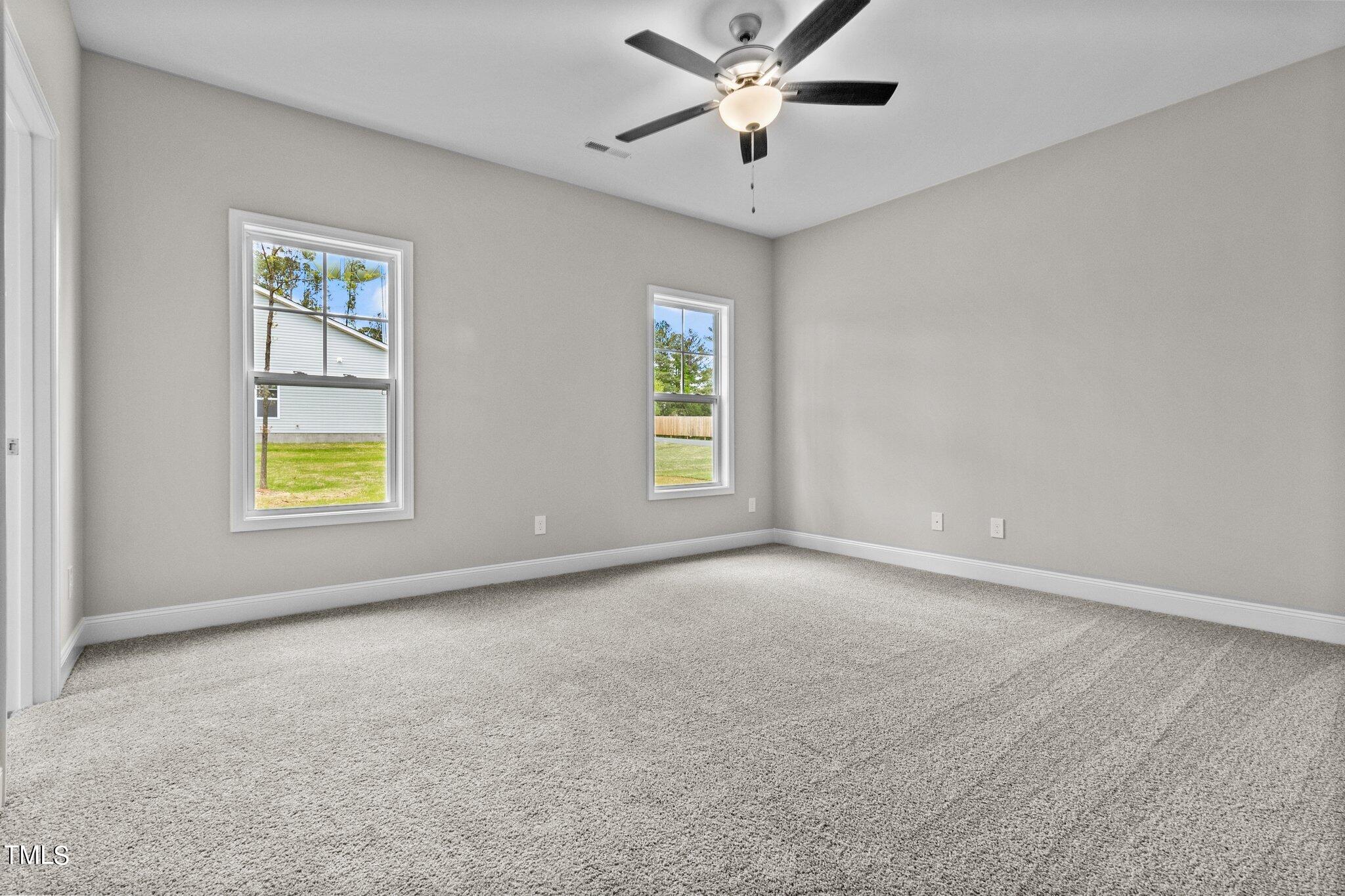 111 Regis Lane Coats, NC 27521 - Photo 21 of 36 a view of an empty room with a window