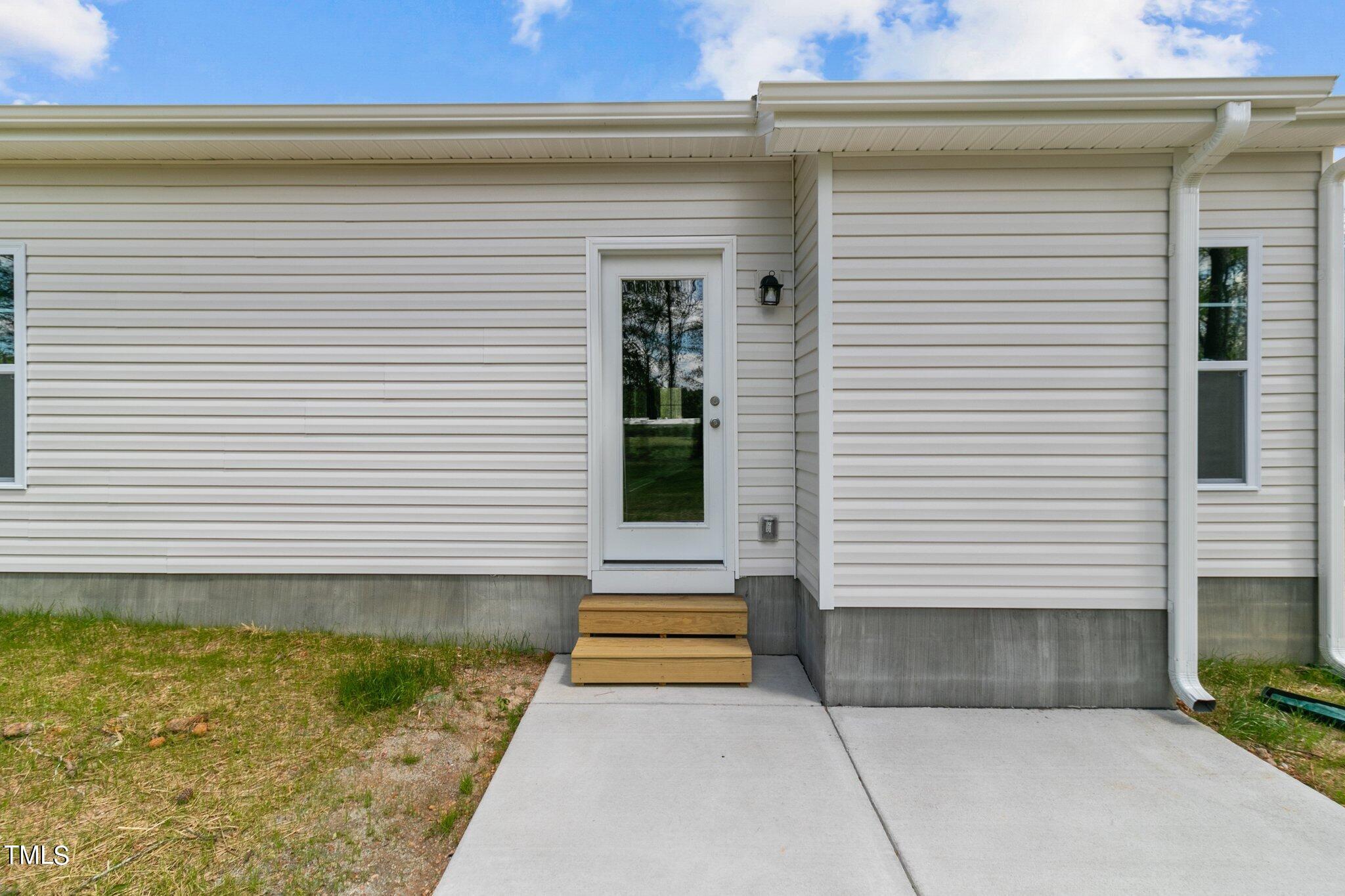 111 Regis Lane Coats, NC 27521 - Photo 27 of 36 a view of front door of house