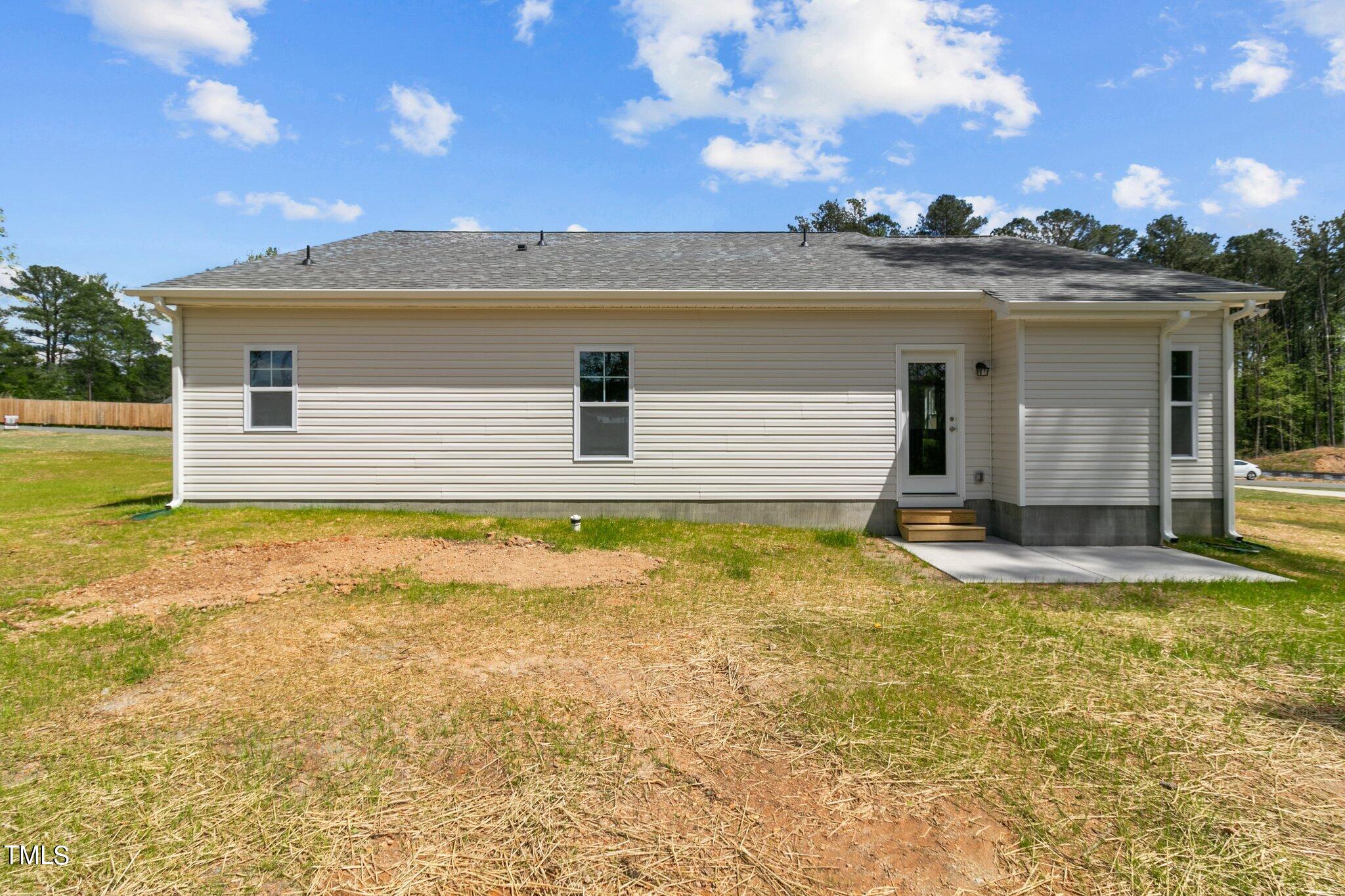 111 Regis Lane Coats, NC 27521 - Photo 28 of 36 a view of a house with swimming pool and a yard