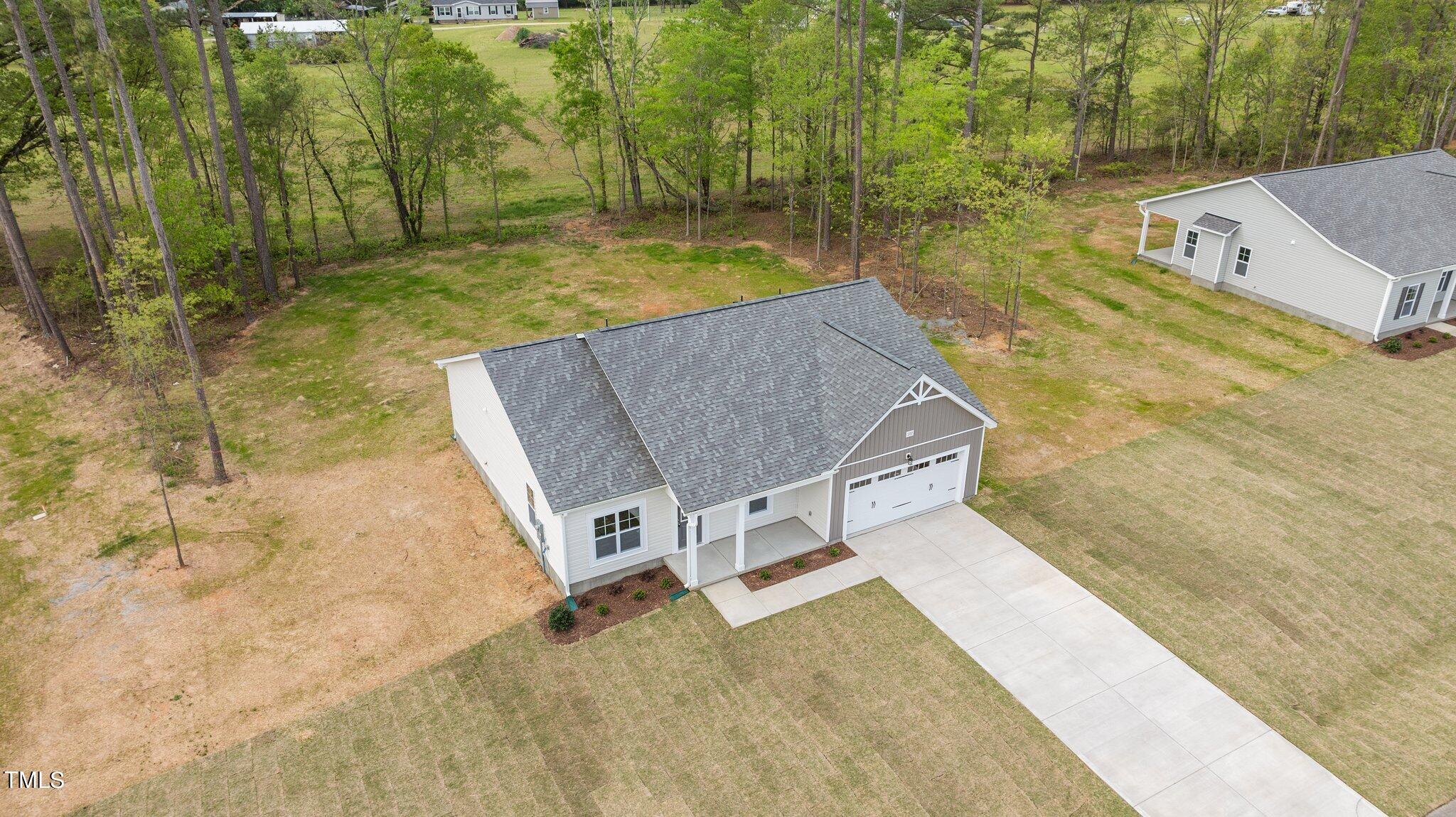 111 Regis Lane Coats, NC 27521 - Photo 31 of 36 a view of a swimming pool with a yard