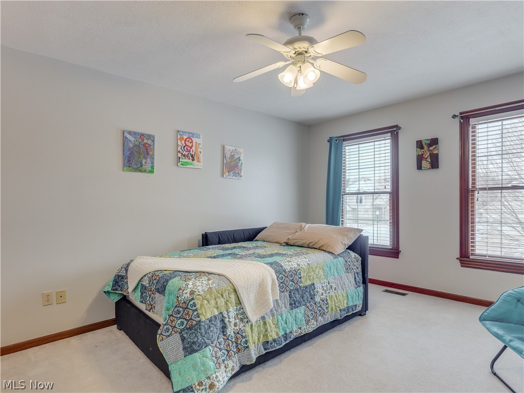 1794 Summerchase Road Northeast Canton, OH 44721 - Photo 24 of 32 Bedroom 2 of 4 with walk in closet and large windows