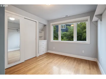 a bathroom with a double vanity sink mirror and toilet