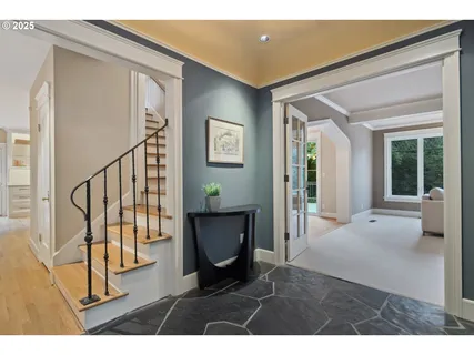 a view of an entryway with wooden floor