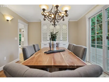 a room with pool table and windows