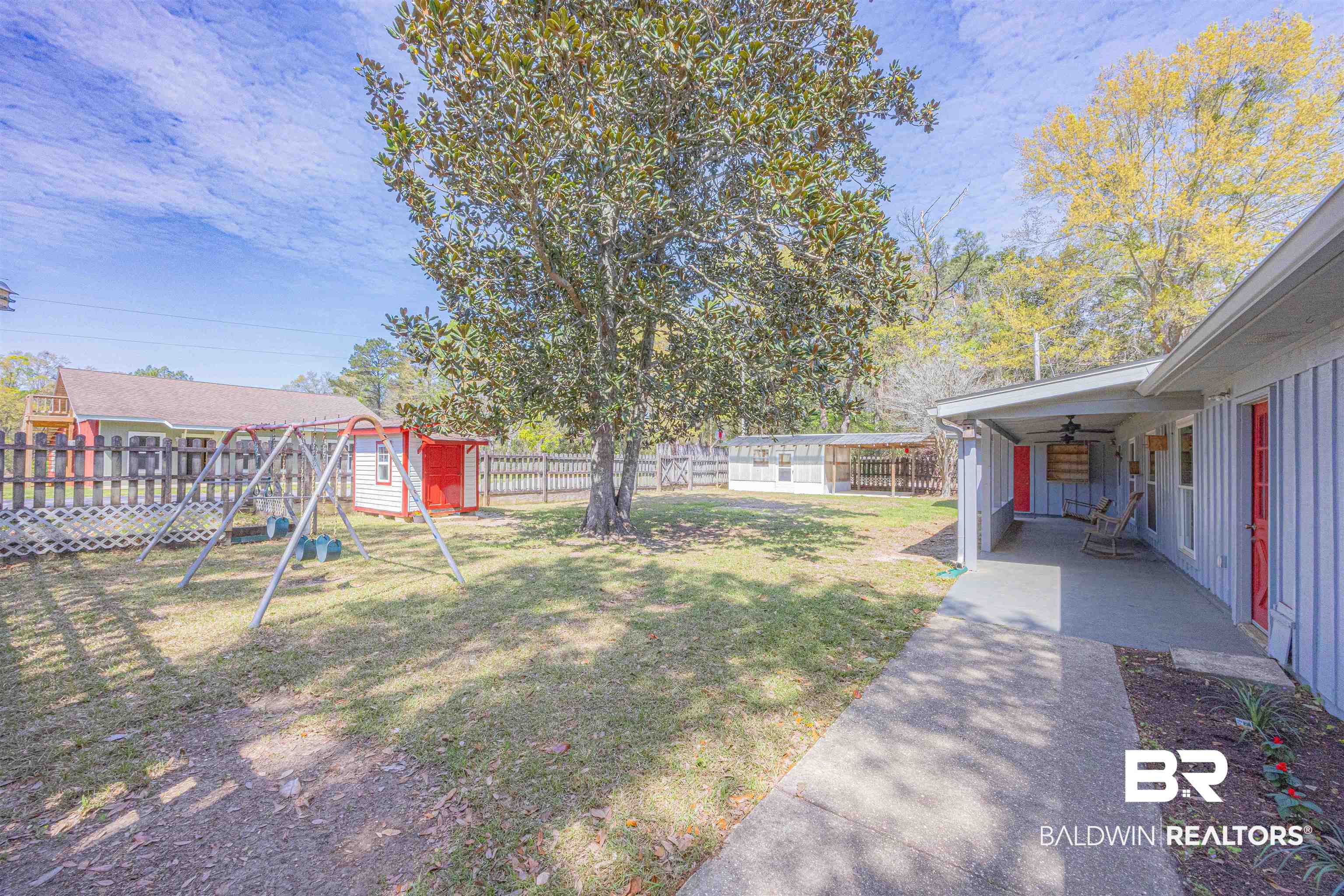 43101 Brown Road Bay Minette, AL 36507 - Photo 50 of 81 Fenced backyard with playhouse, swing set ,greenhouse and small garden area