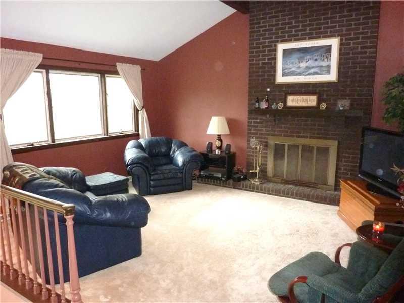 362 Denny Road Valencia, PA 16059 - Photo 3 of 19 Living Room. The living room has lots of character offering a vaulted beamed ceiling and a floor-to-ceiling brick fireplace.