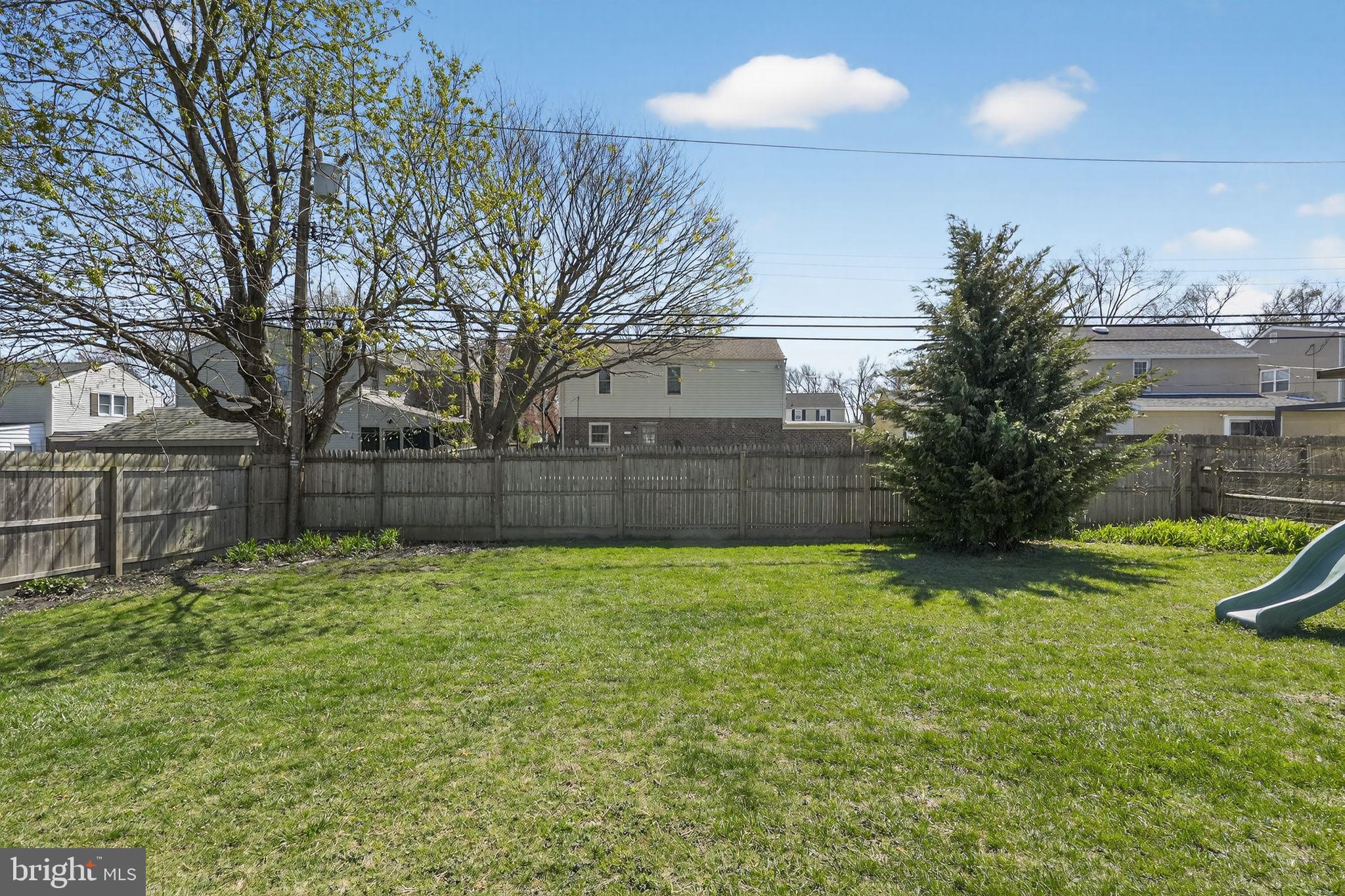 226 Potomac Road Wilmington, DE 19803 - Photo 28 of 29 Spacious backyard with lush greenery.