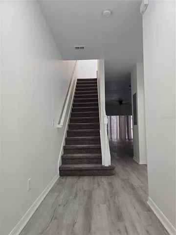 a view of a hallway with stairs