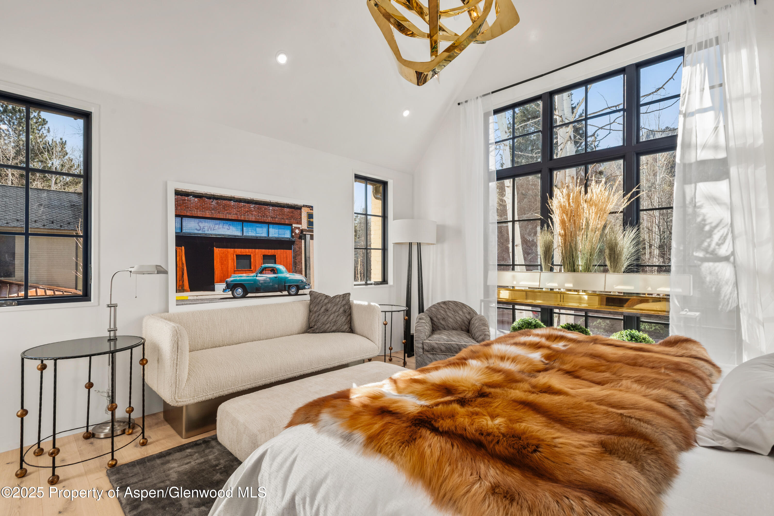 502 North 6th Street Aspen, CO 81611 - Photo 12 of 16 a bedroom with two beds and a flat screen tv