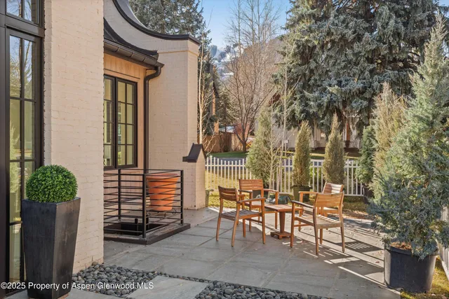 a bedroom with two beds and a flat screen tv