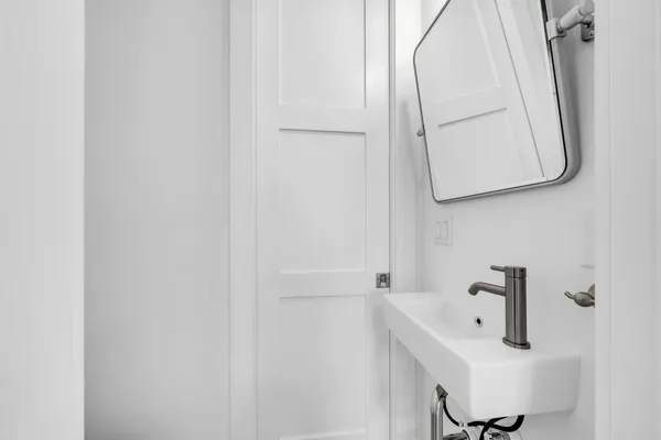 a bathroom with a sink and mirror