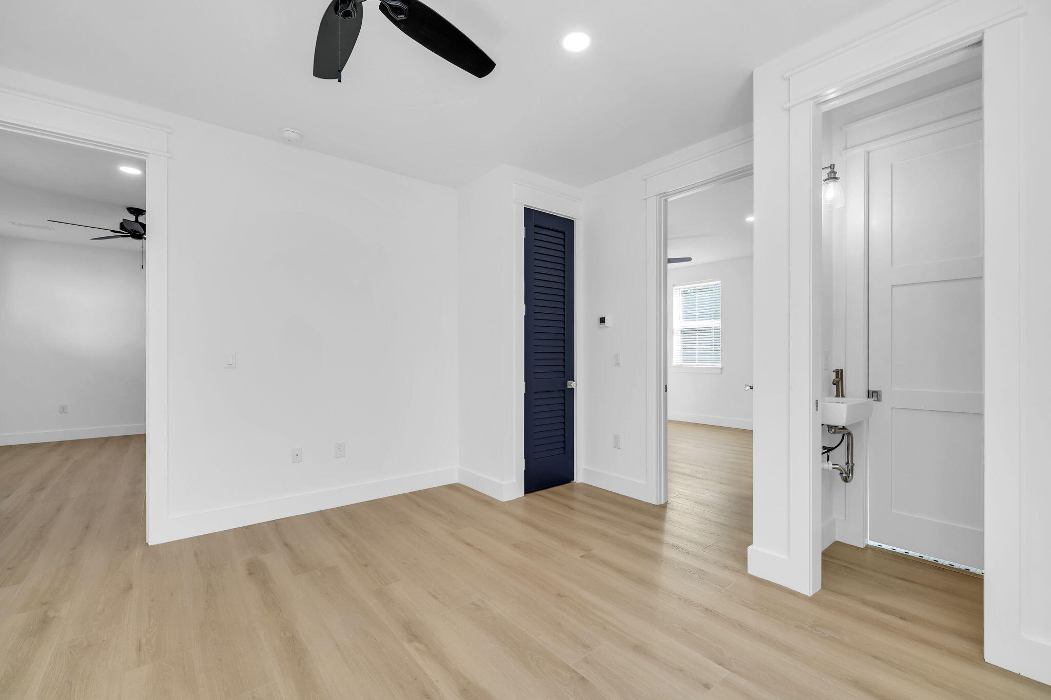 119 Osprey Lane Santa Rosa Beach, FL 32459 - Photo 26 of 35 wooden floor in an empty room with a bathroom