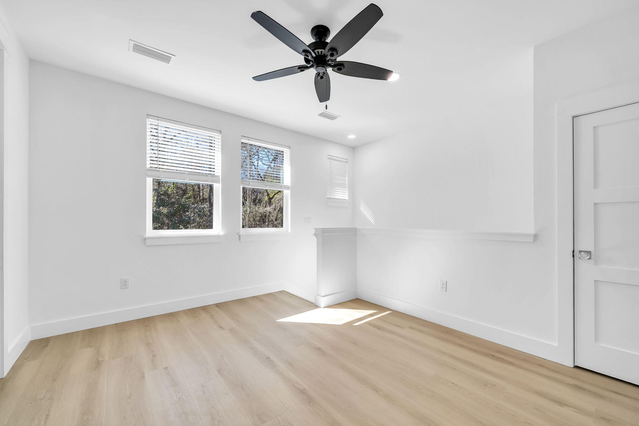 119 Osprey Lane Santa Rosa Beach, FL 32459 - Photo 27 of 35 wooden floor in an empty room with a window