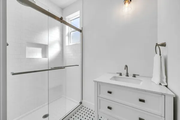 a bathroom with a sink and a mirror