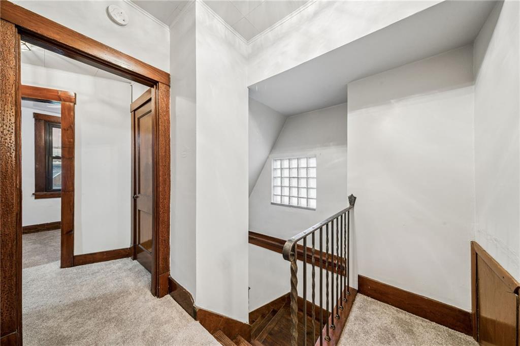 620 Broadway Avenue McKees Rocks, PA 15136 - Photo 8 of 18 a view of staircase with lots of frames and a window