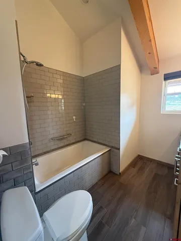 a view of a hardwood floor in a room