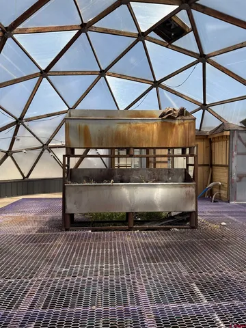 a view of a backyard of the house