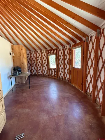 a view of a yard with a tree