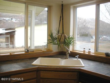 4208 Thorp Road Moxee, WA 98936 - Photo 14 of 21 a view of a sink and a counter top space