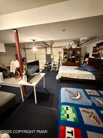 a living room with lots of furniture and clutter