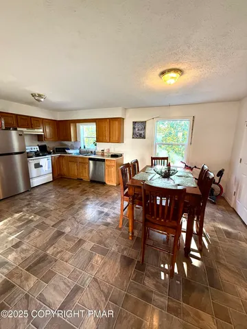 a view of a dining room with furniture