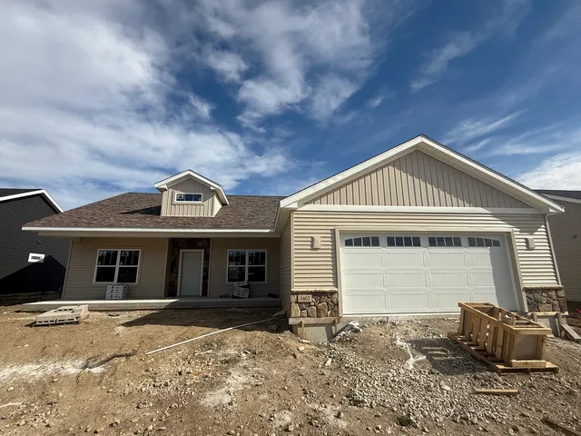 a kitchen with a sink and wooden cabinets