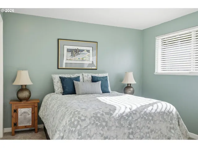 a bedroom with a bed and a couch