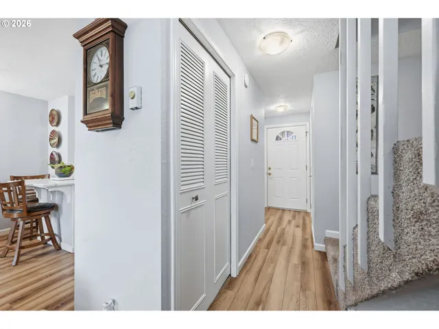a living room with furniture a window and a flat screen tv