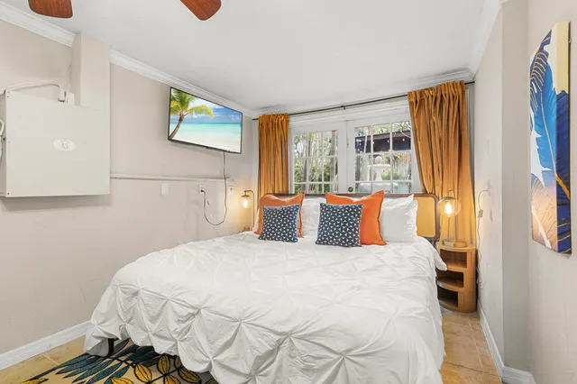 a living room with furniture flowerpot and a window