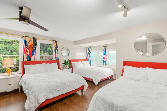 a living room with furniture and a dining table