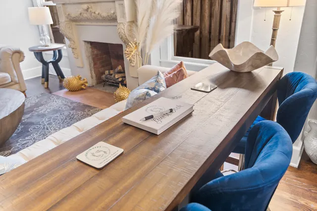 a swimming pool with outdoor seating and yard