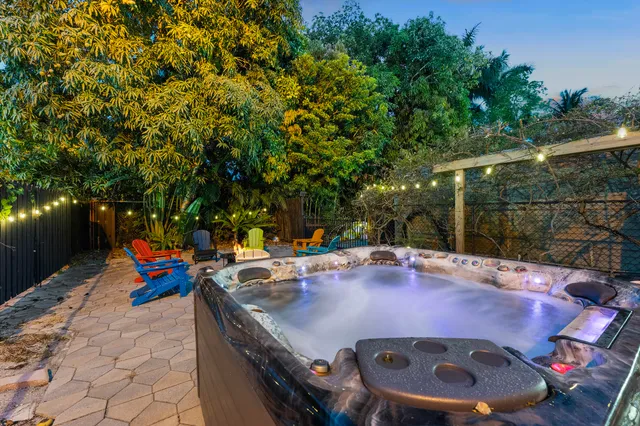 a view of a swimming pool with a table and chairs