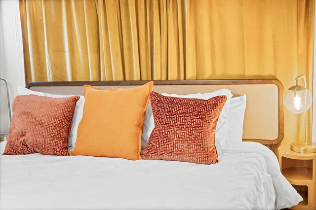 a view of a hallway with paintings on the wall