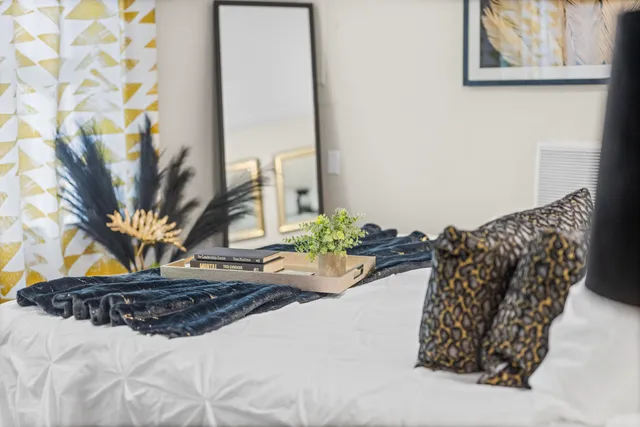 a living room with blue lights with furniture and fish tank
