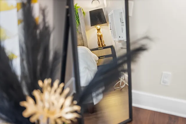 a bedroom with furniture and a bed