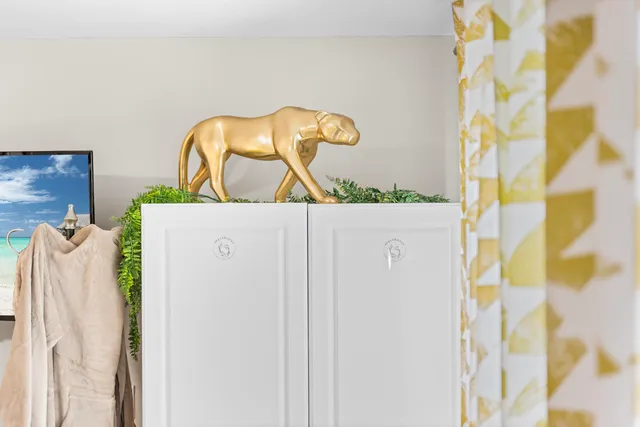 a backyard of a house with fountain table and chairs