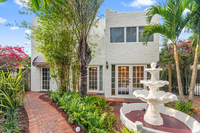 a living room with furniture and flat screen tv