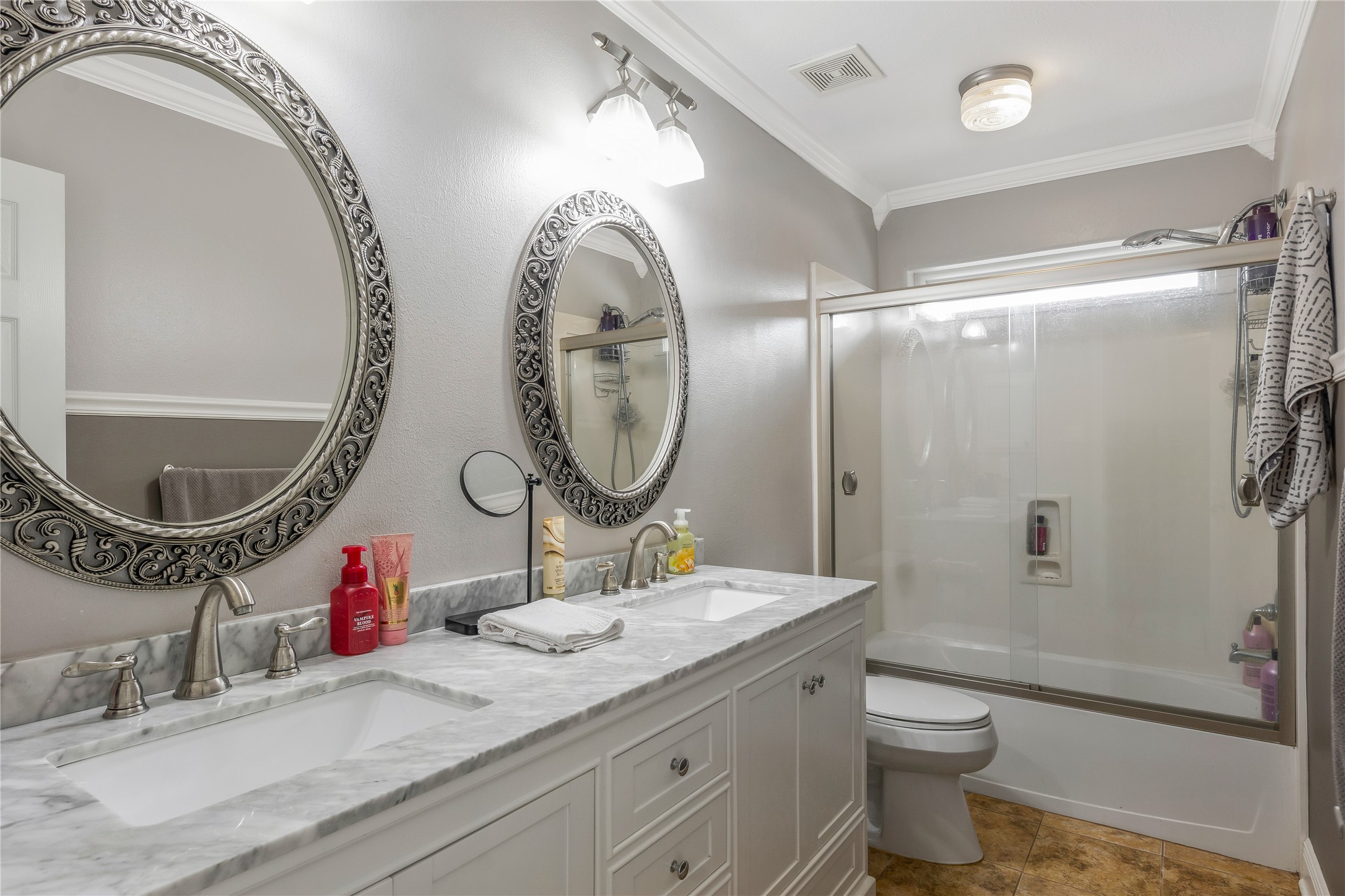 13914 Skinner Road Cypress, TX 77429 - Photo 24 of 50 Full bathroom with a long vanity, plenty of counter space, and a tub and shower combination.
