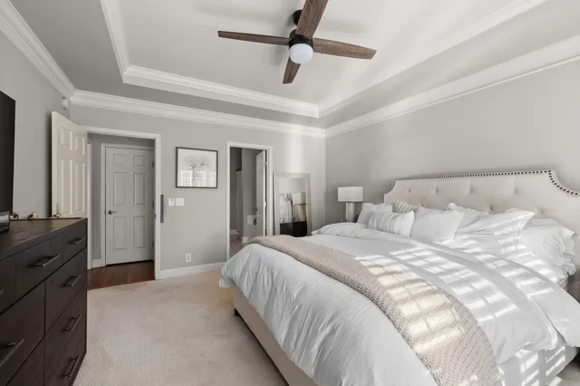 a bedroom with a bed and a television