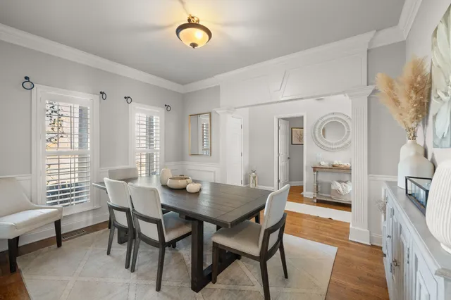 a view of a dining room with furniture and window