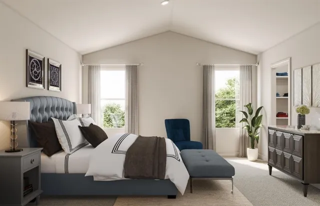 a bedroom with furniture and windows