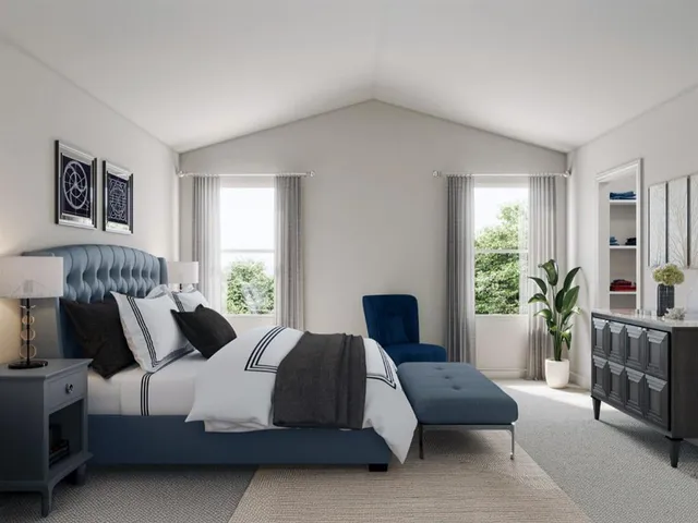 a bedroom with a bed and a couch