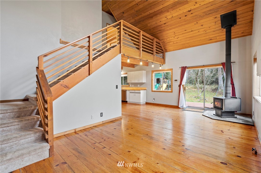 15542 Runyon Road Southeast Rainier, WA 98576 - Photo 14 of 23 a view of a terrace with wooden floor and windows