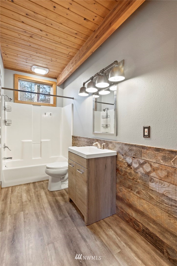 15542 Runyon Road Southeast Rainier, WA 98576 - Photo 7 of 23 a view of room with wooden floor