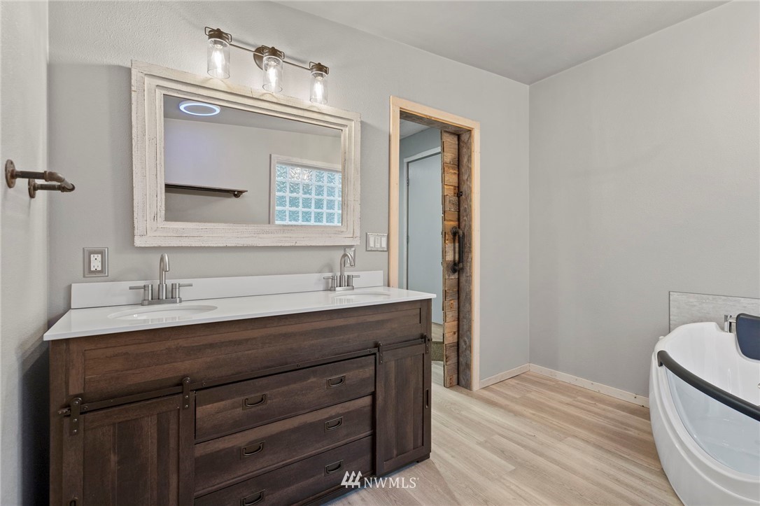 15542 Runyon Road Southeast Rainier, WA 98576 - Photo 10 of 23 a bathroom with a sink a vanity and a mirror