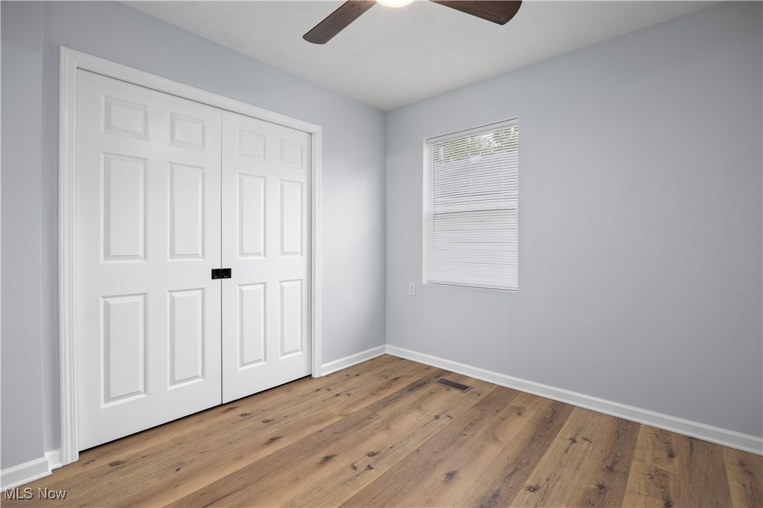 4341 Laurel Road Lorain, OH 44055 - Photo 11 of 36 Unfurnished bedroom with a closet, light hardwood / wood-style floors, and ceiling fan